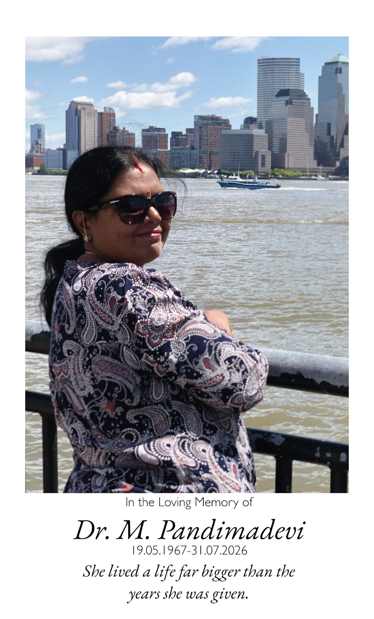 Amma looking over her shoulder at the New York City skyline. She lived a life far bigger than the years she was given.