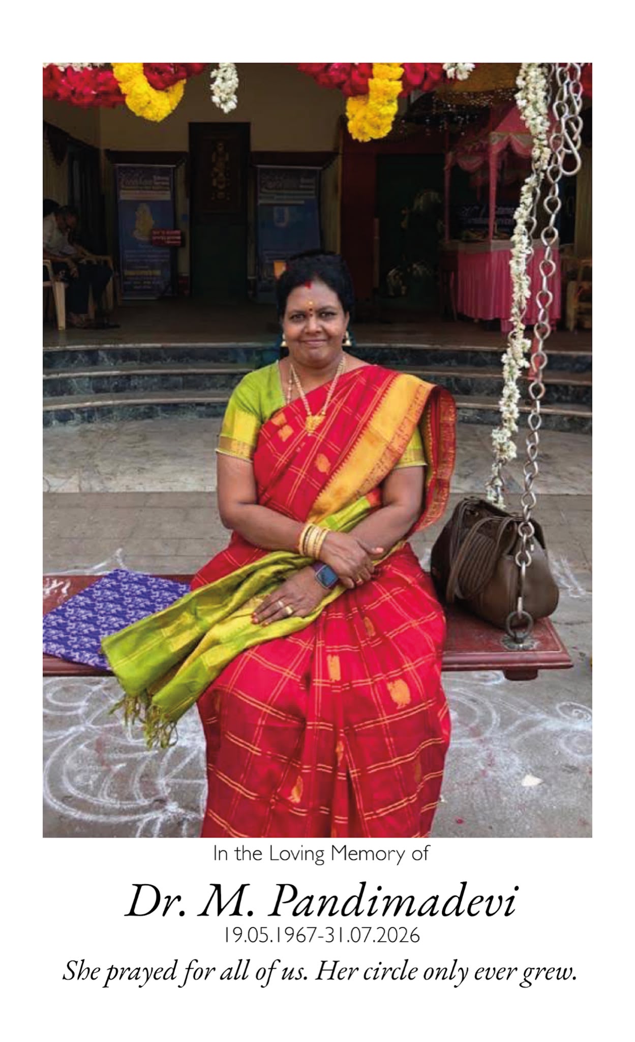 Amma seated on a swing at a decorated temple hall. She prayed for all of us. Her circle only ever grew.